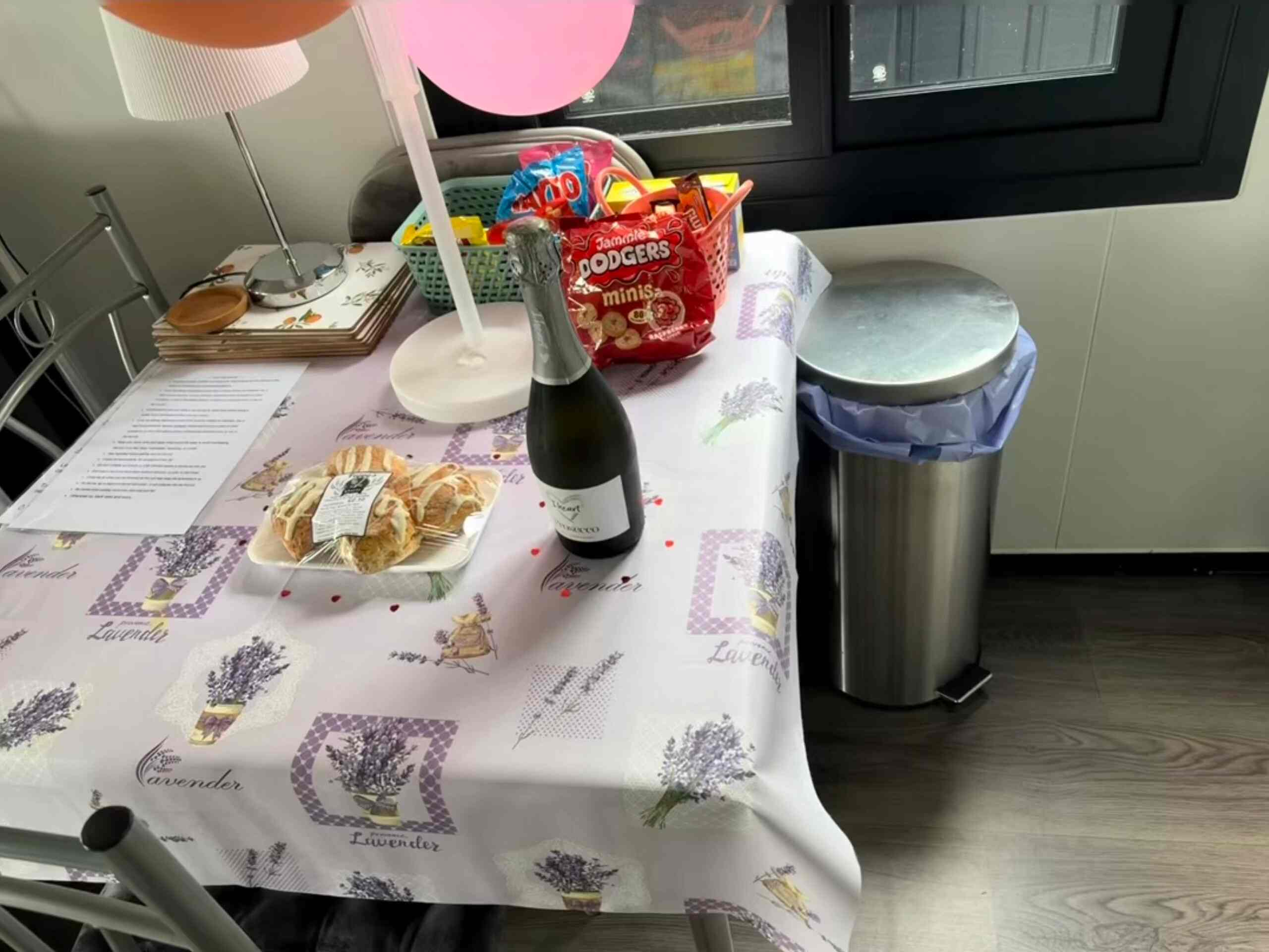 Table laid with fizz, fresh scones and a basket of treats ready for arrival