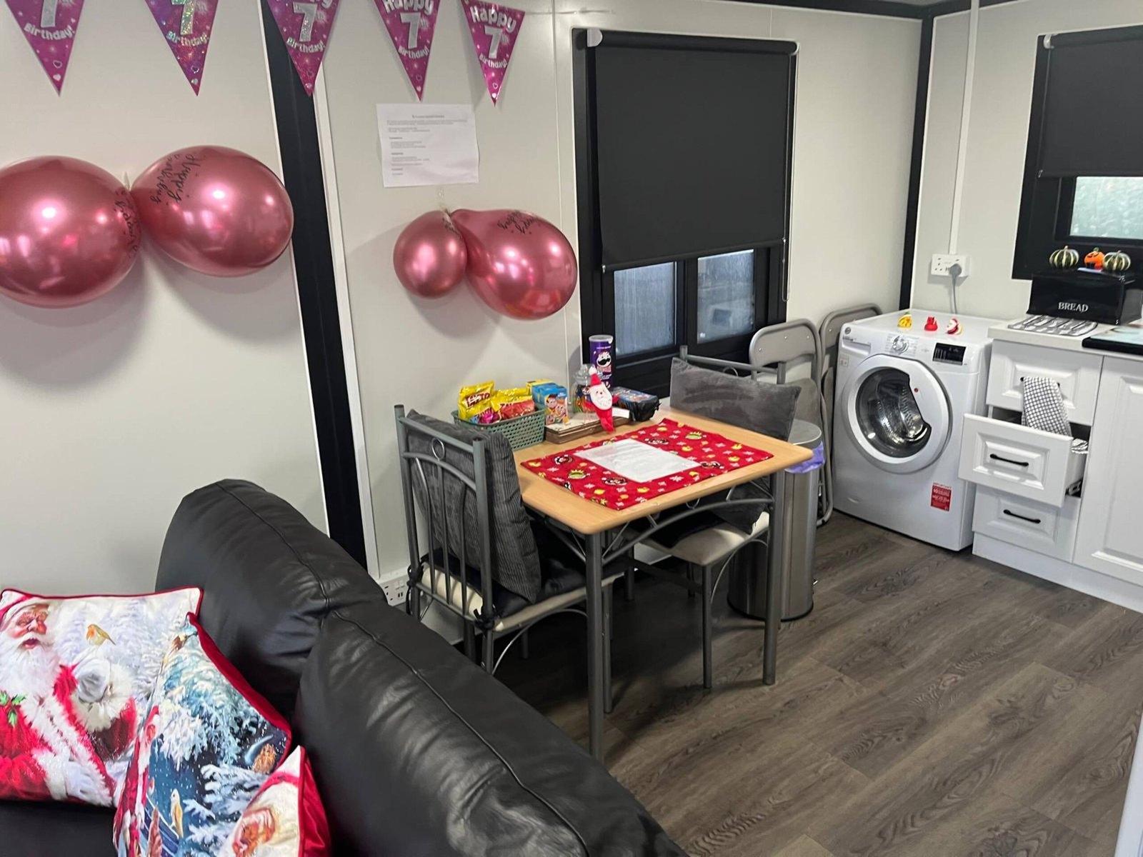 Kitchen and dining area decorated with birthday bunting and balloons